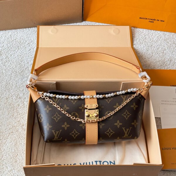 Louis Vuitton Pochette Mia Handbag